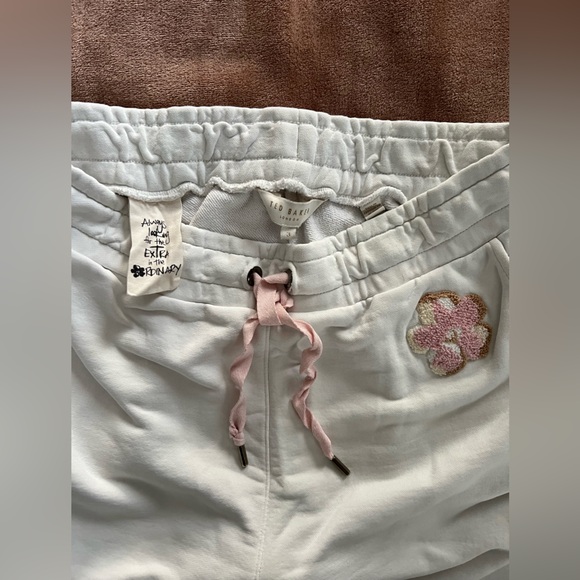 Aritzia White Joggers with Pink Floral Accent - Picture 2 of 3